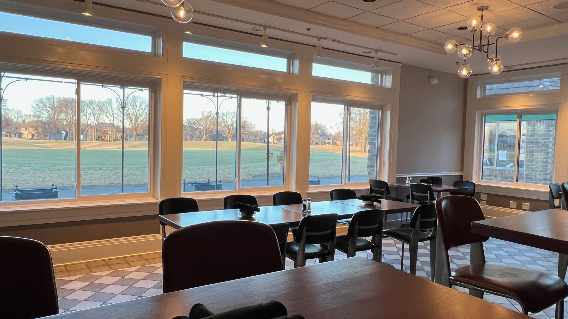 Seating looks out onto the patio and golf course